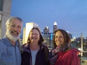 Photo of board members, three people.